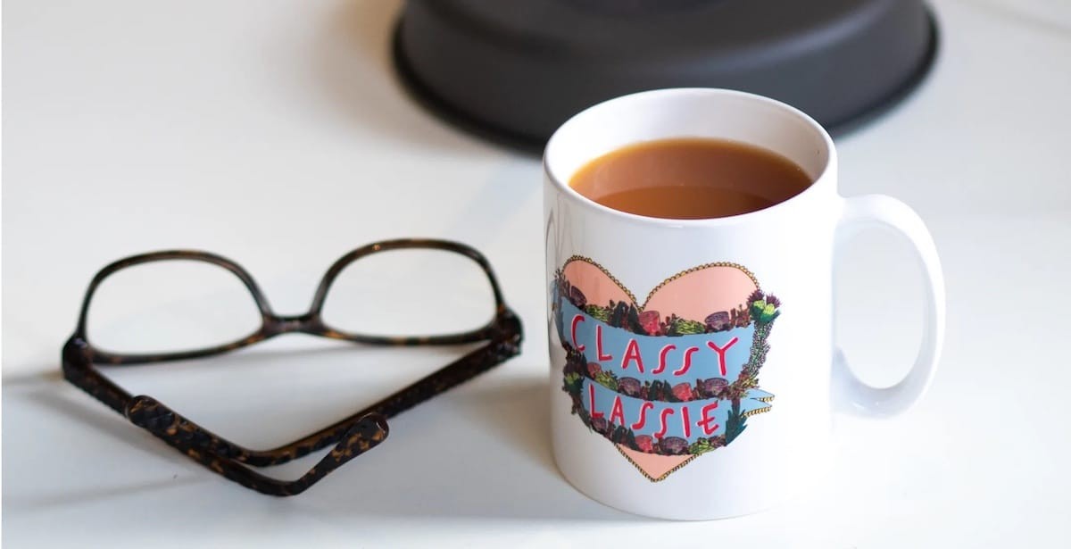 A mug on an add jam desk.